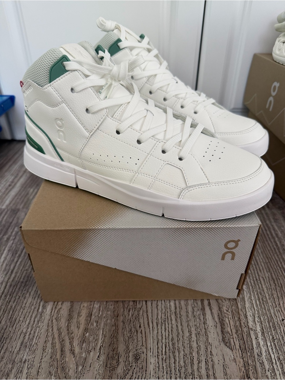 On Cloud High-Top Sneakers in White with Green Accents - Men's